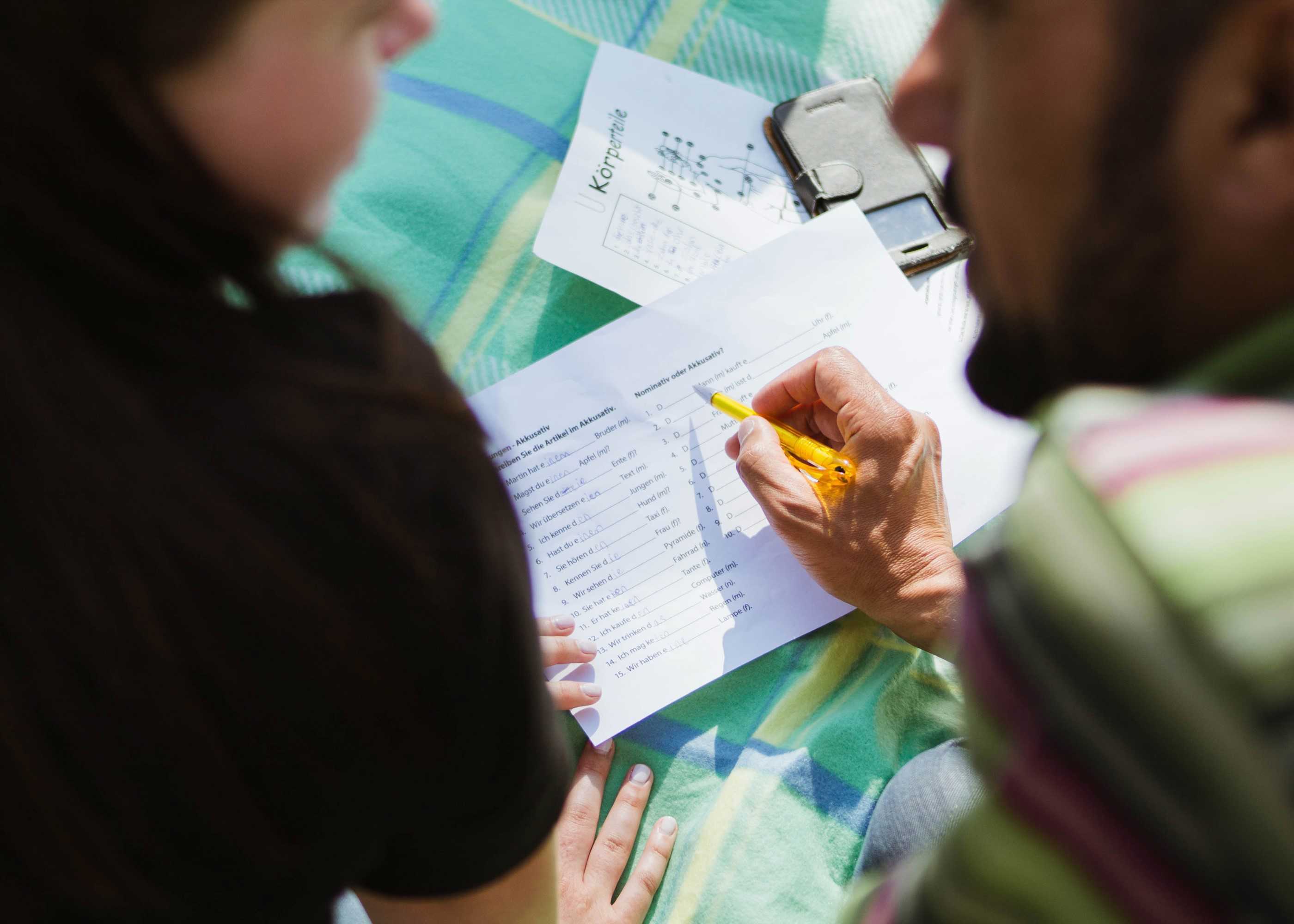 People talking and writing notes